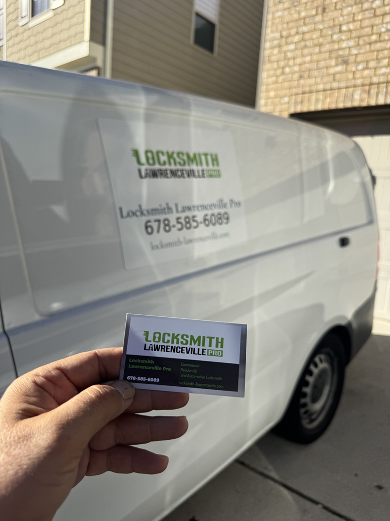 Locksmith Lawrenceville Pro Mobile Service Van White Locksmith Lawrenceville Pro van with green branding and phone number, with a business card held in front